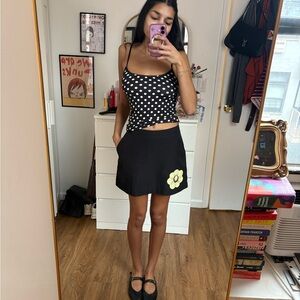 Vintage Tail Black Mini Skirt with Yellow Floral Accent